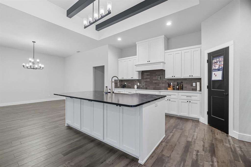6502 Randy Avenue Abilene, TX 79606 - Photo 3 of 37 a kitchen with stainless steel appliances granite countertop a sink stove and refrigerator