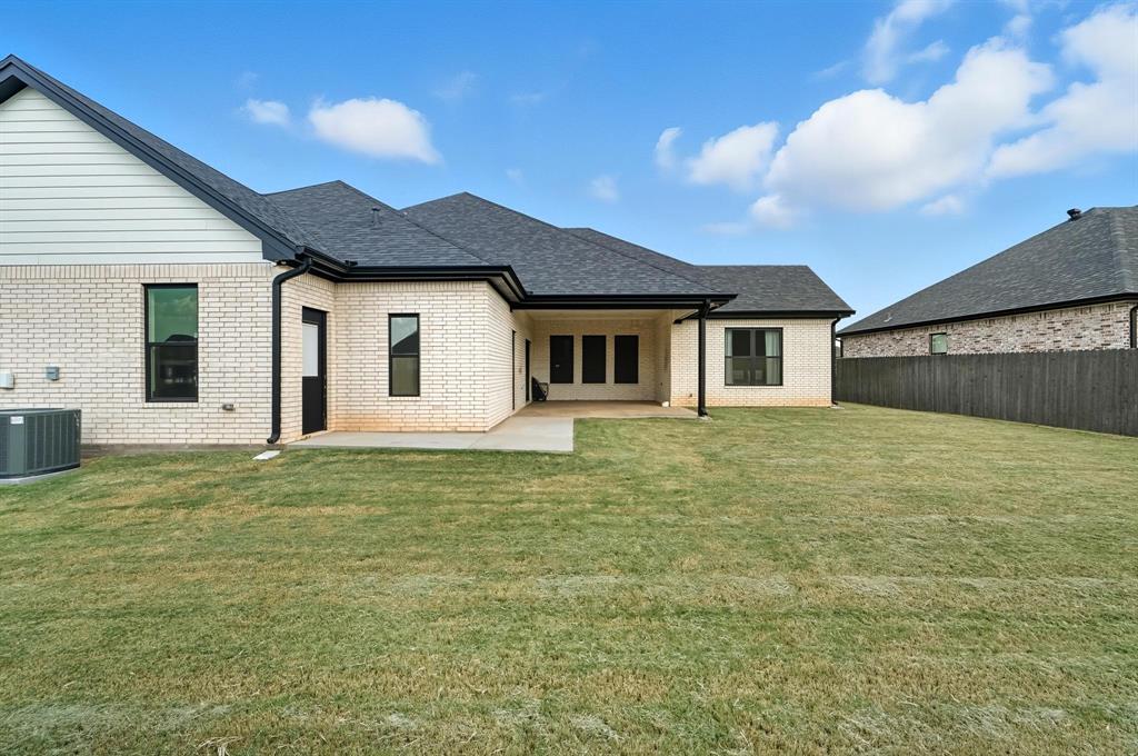 6502 Randy Avenue Abilene, TX 79606 - Photo 32 of 37 a front view of a house with a yard