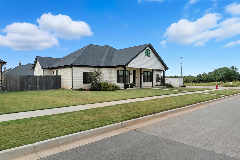 6502 Randy Avenue Abilene, TX 79606 - Photo 34 of 37 a front view of a house with a garden and yard