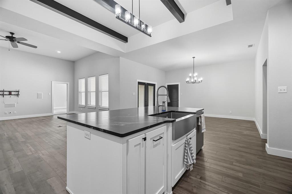 6502 Randy Avenue Abilene, TX 79606 - Photo 36 of 37 a kitchen with granite countertop a sink and stove