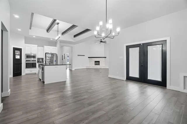a kitchen with stainless steel appliances a sink and a refrigerator
