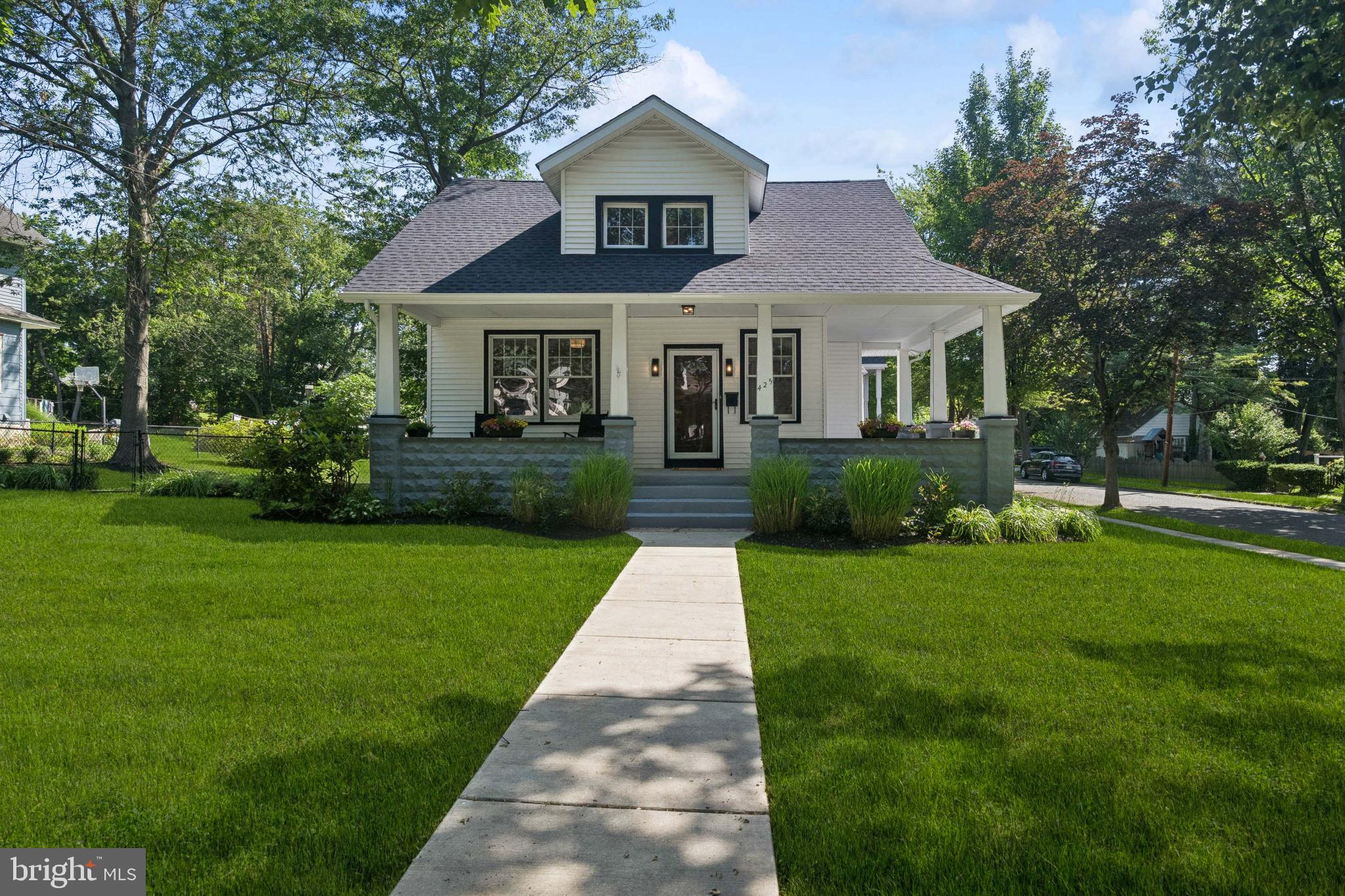 425 4th Avenue Haddon Heights, NJ 08035 - Photo 1 of 26 a front view of a house with a yard