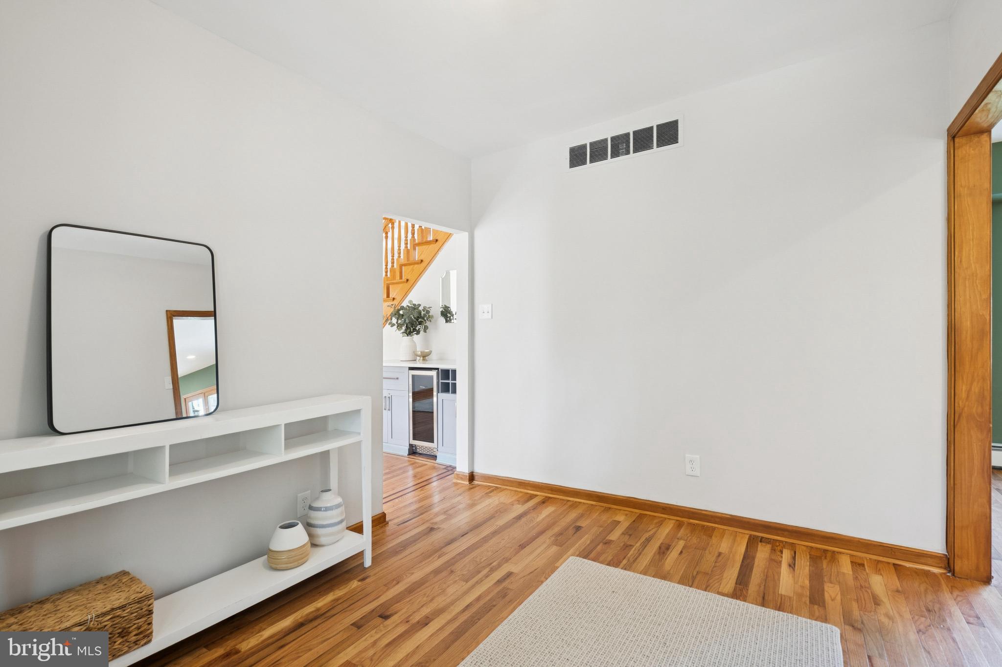 425 4th Avenue Haddon Heights, NJ 08035 - Photo 5 of 26 a view of a bedroom with wooden floor and cabinet