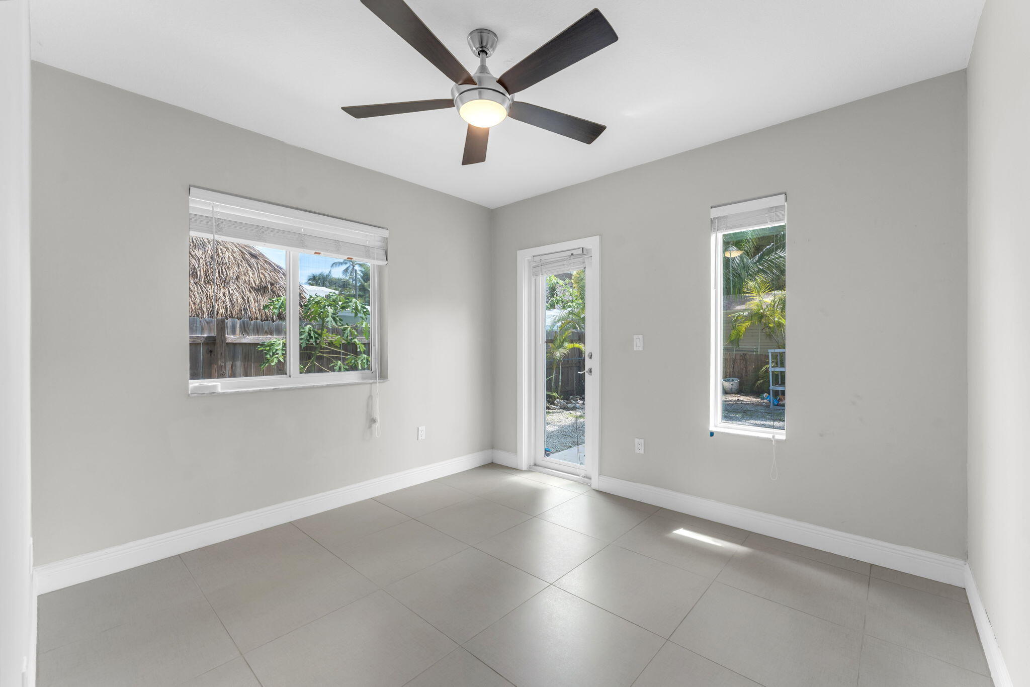 67 Jewfish Avenue Key Largo, FL 33037 - Photo 11 of 43 an empty room with windows and closet
