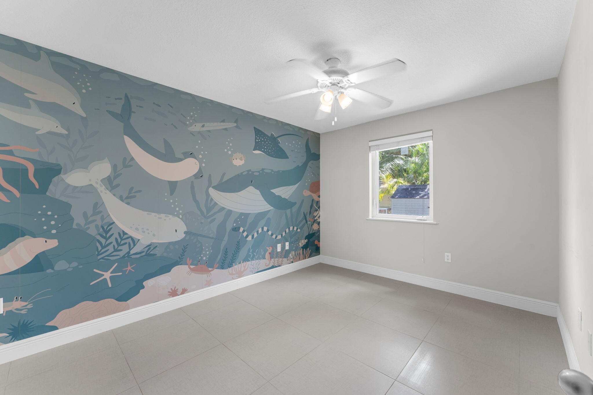 67 Jewfish Avenue Key Largo, FL 33037 - Photo 13 of 43 a view of an empty room with a window