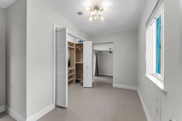 a view of an empty room with a window