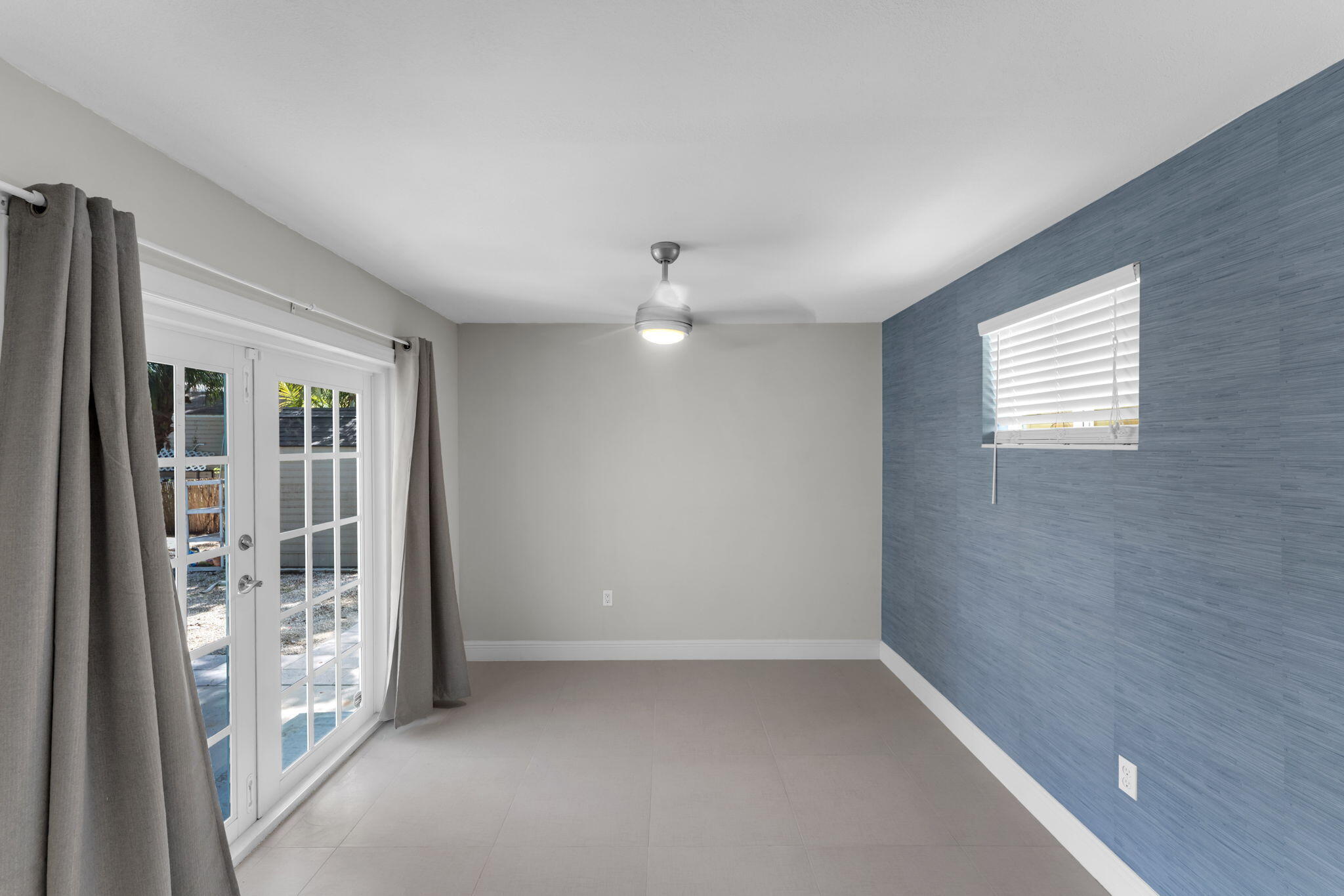 67 Jewfish Avenue Key Largo, FL 33037 - Photo 18 of 43 a view of an empty room with a window