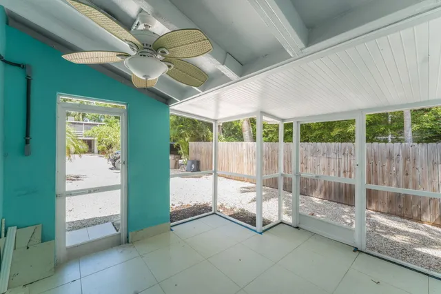 a view of a house with a tree and a yard