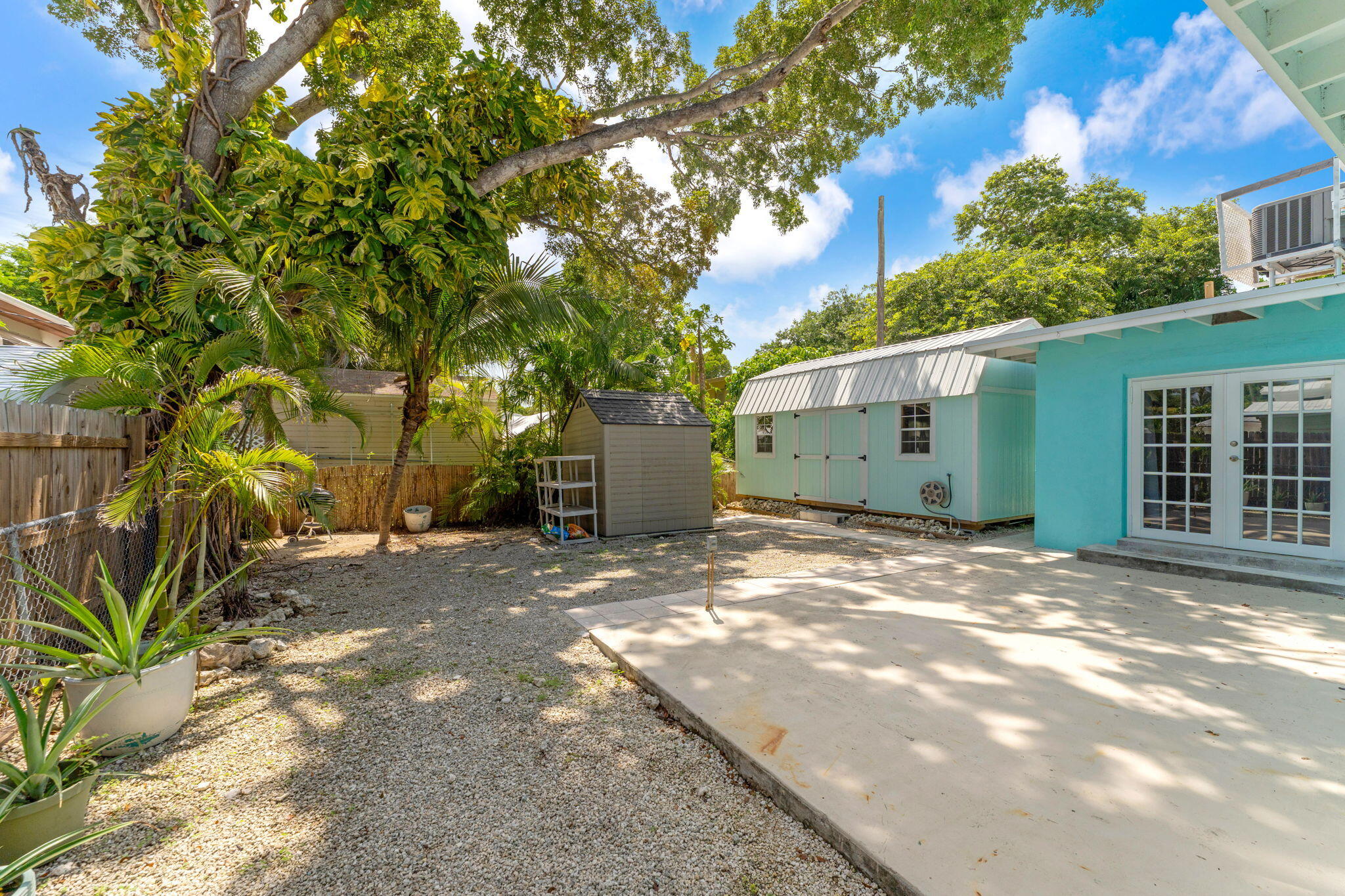 67 Jewfish Avenue Key Largo, FL 33037 - Photo 23 of 43 a view of a house with a tree and a yard