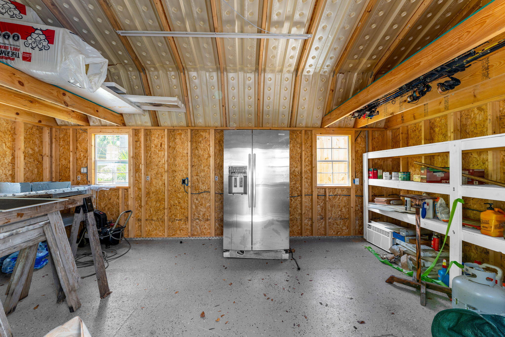 67 Jewfish Avenue Key Largo, FL 33037 - Photo 25 of 43 a view of walk in closet with clothes and shoes