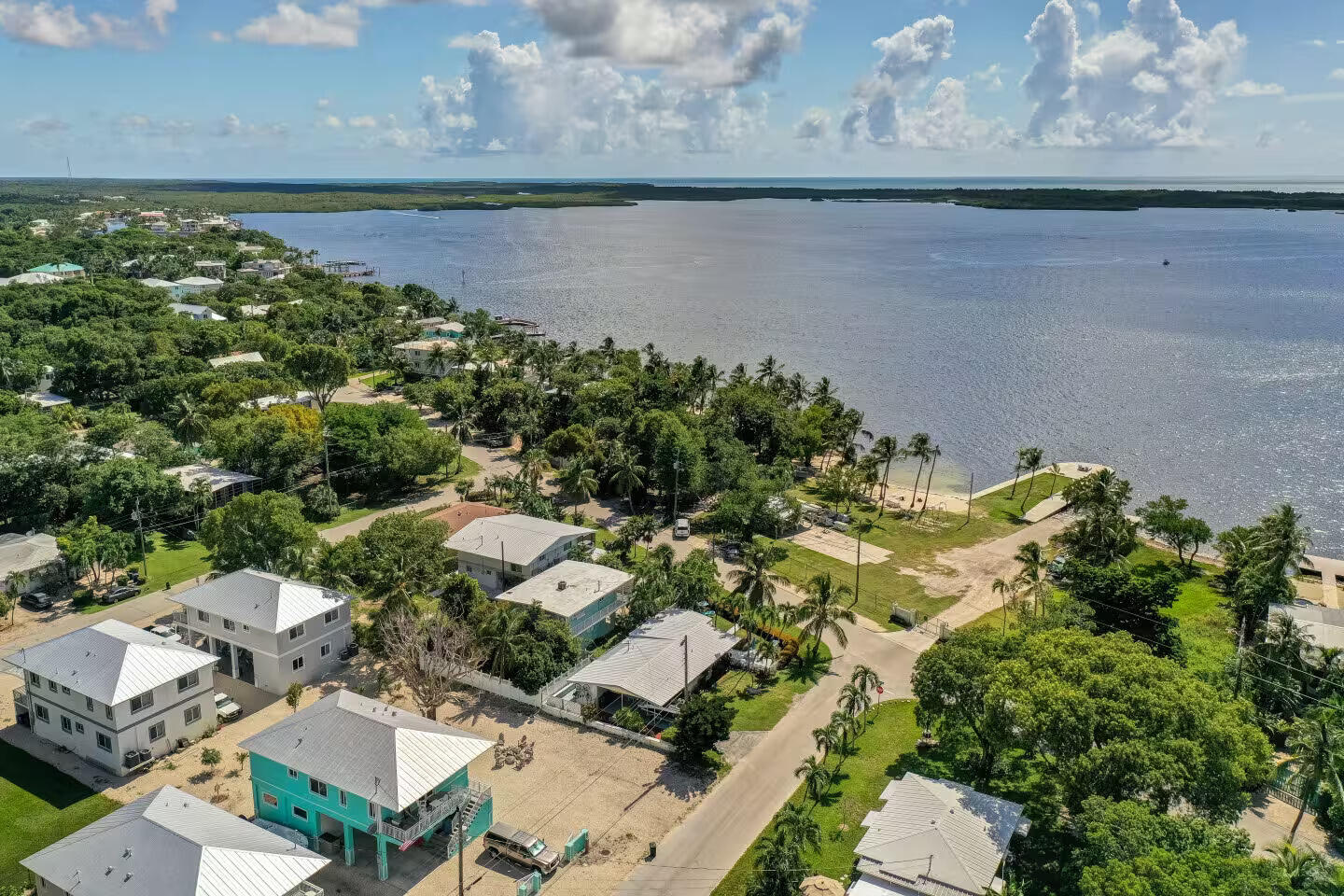 67 Jewfish Avenue Key Largo, FL 33037 - Photo 39 of 43 an aerial view of residential houses with outdoor space and lake view