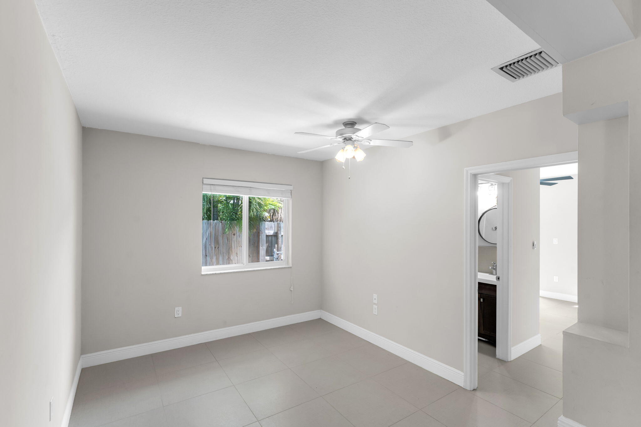 67 Jewfish Avenue Key Largo, FL 33037 - Photo 8 of 43 an empty room with windows and closet