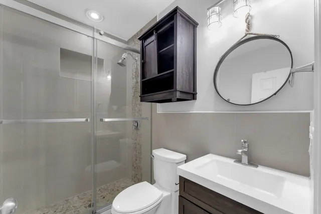 an empty room with windows and closet