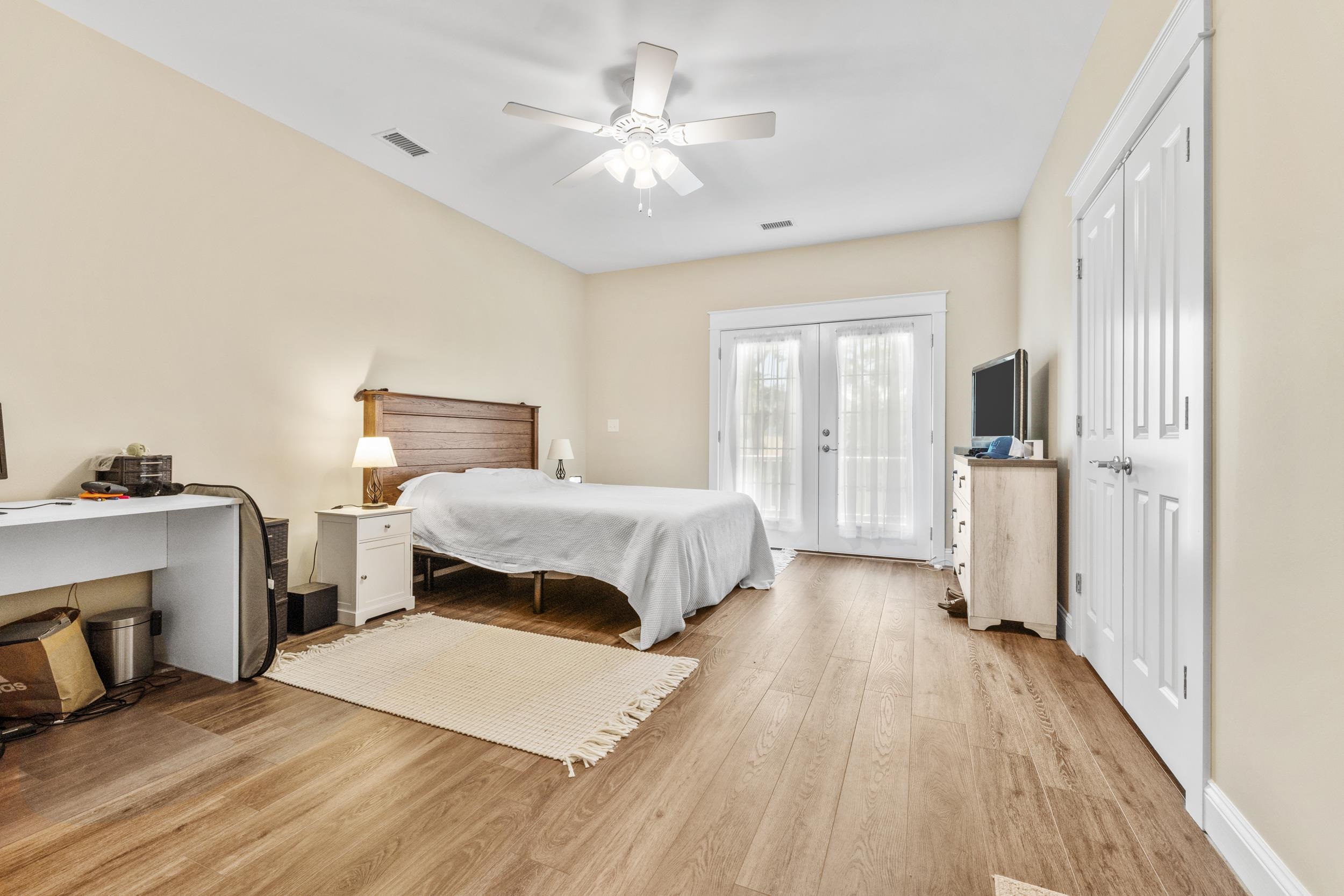 5907 Haskell Circle Myrtle Beach, SC 29577 - Photo 22 of 38 Bedroom with french doors, light wood-type flooring, a ceiling fan, and access to outside