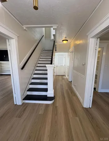 a view of entryway with wooden floor