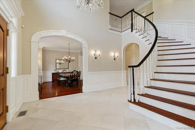 a view of entryway livingroom and hall with wooden floor