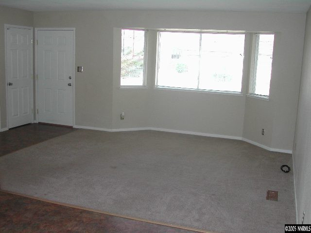 25 Ouzel Way Reno, NV 89508 - Photo 3 of 8 an empty room with a window