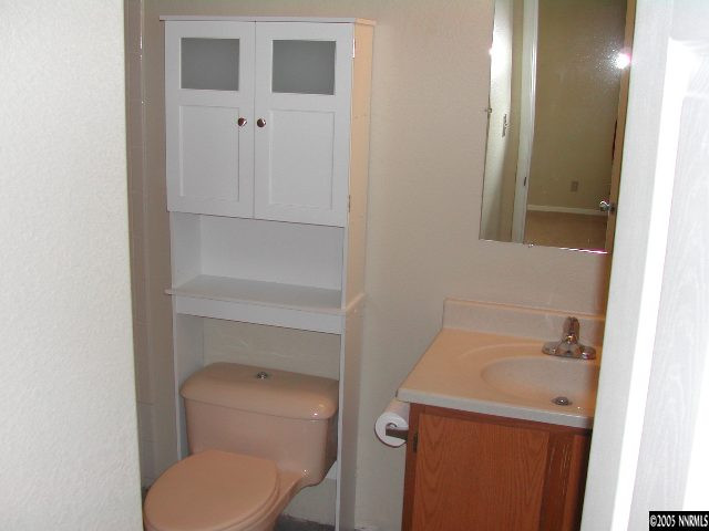 25 Ouzel Way Reno, NV 89508 - Photo 6 of 8 a bathroom with a toilet and a sink