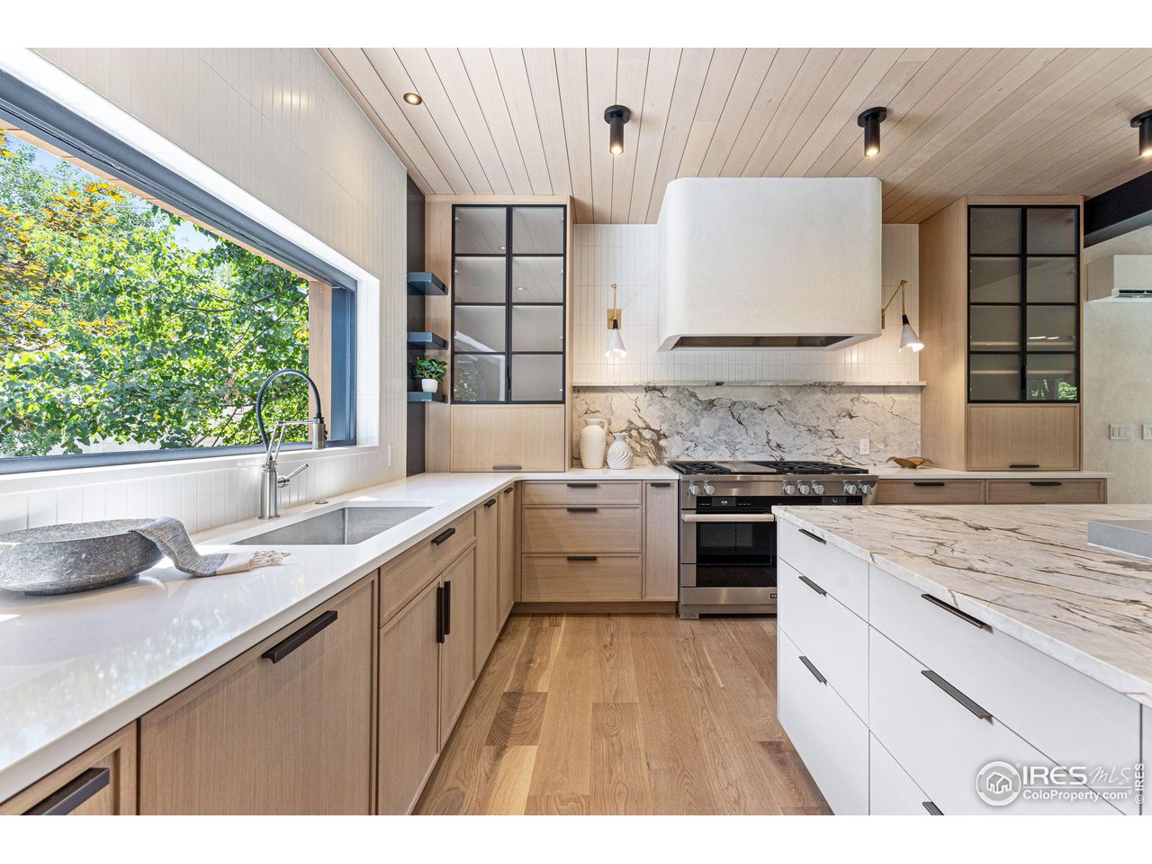 814 7th Street Boulder, CO 80302 - Photo 15 of 40 Pass thru window to deck overlooking the yard