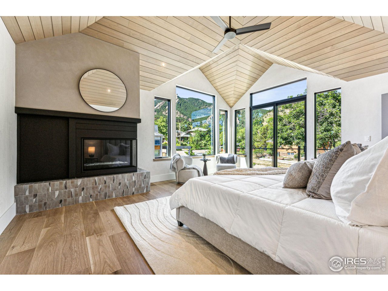 814 7th Street Boulder, CO 80302 - Photo 23 of 40 Primary suite with 2 sided fireplace