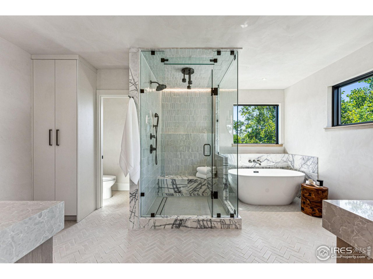 814 7th Street Boulder, CO 80302 - Photo 27 of 40 Primary shower and tub with incredible Flatiron views