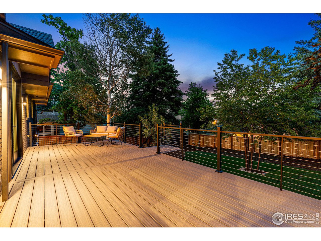 814 7th Street Boulder, CO 80302 - Photo 37 of 40 Trex deck with pass thru window to kitchen