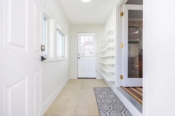 a kitchen with wooden cabinets and sink