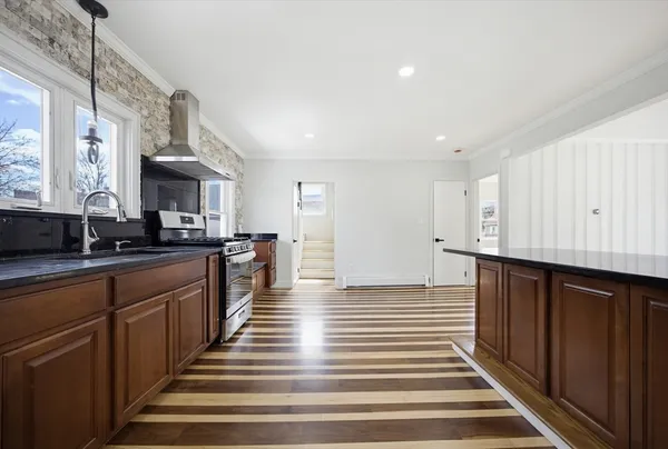 a view of kitchen with wooden floor