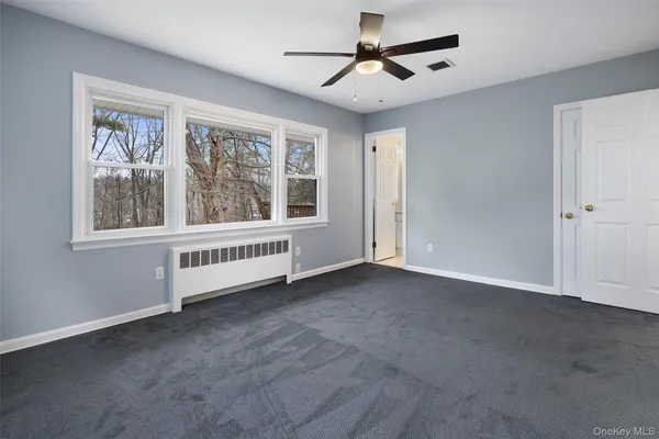 a bedroom with a bed furniture and a window