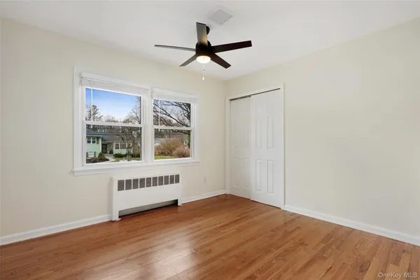 a bedroom with furniture and a window