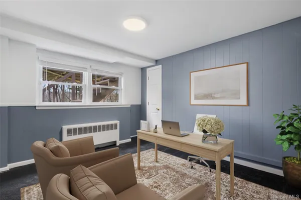 a view of a room with wooden floor and window
