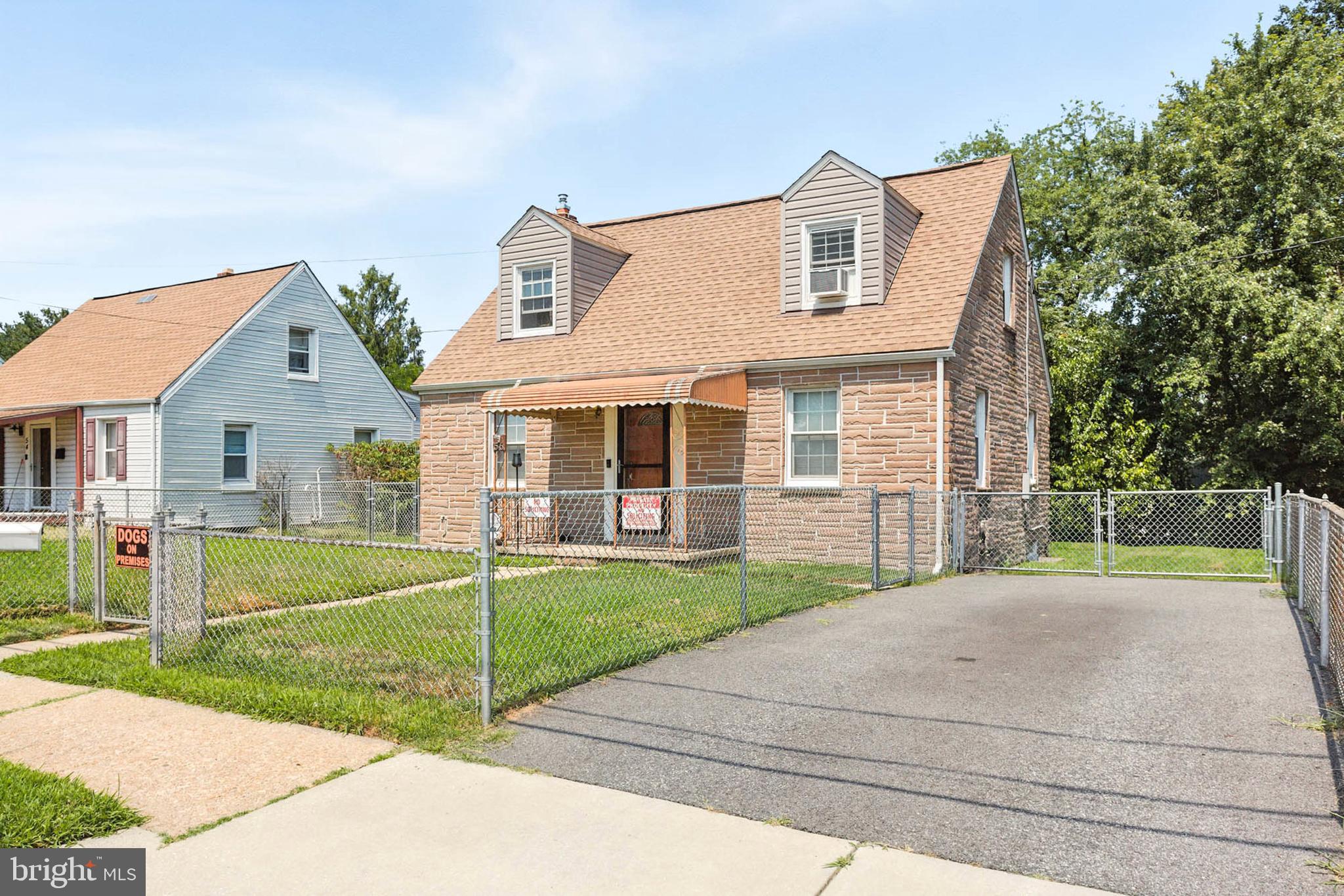 56 Ridgemoor Road Essex, MD 21221 - Photo 1 of 27 a front view of a house with a yard and porch
