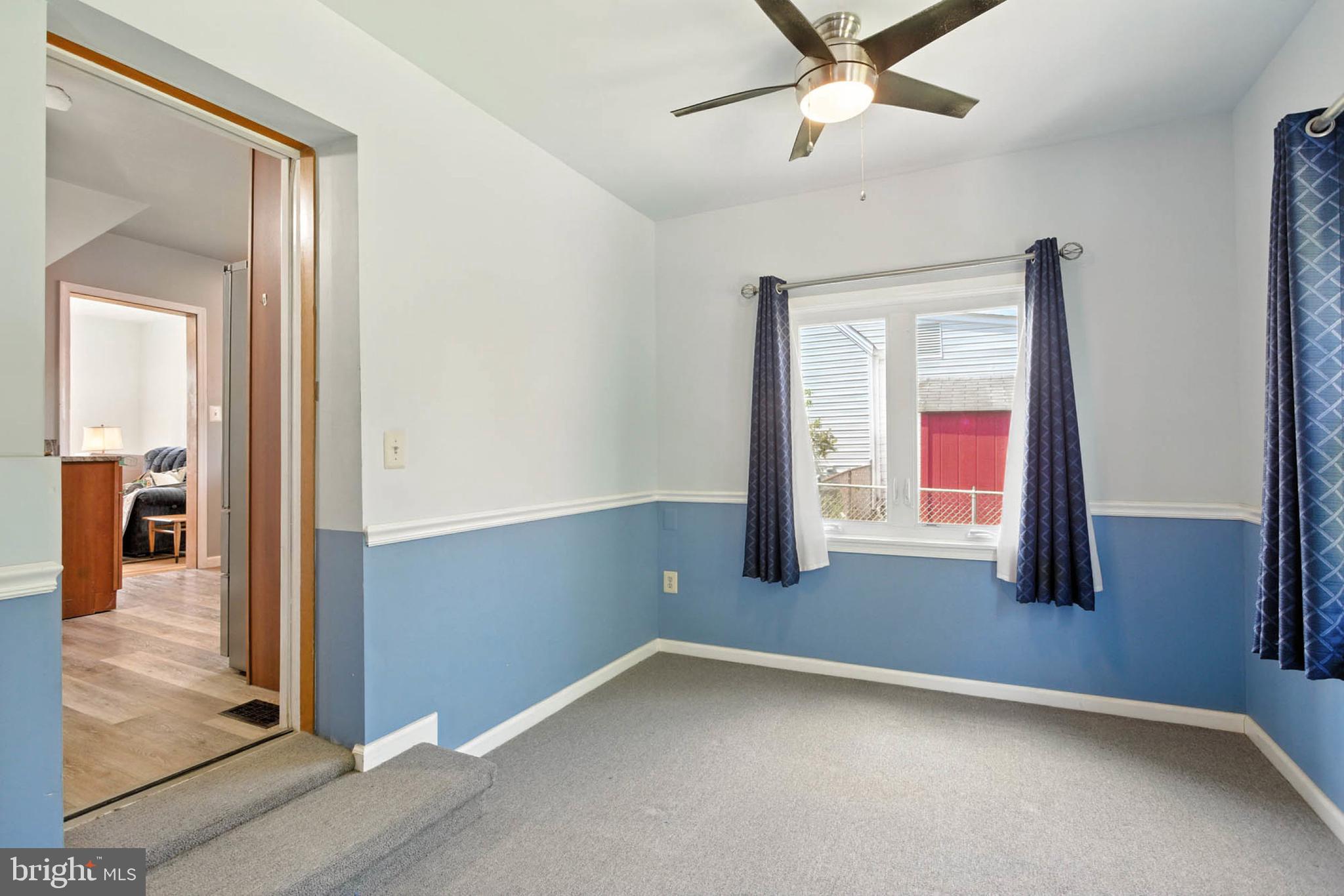 56 Ridgemoor Road Essex, MD 21221 - Photo 12 of 27 wooden floor in an empty room with a window