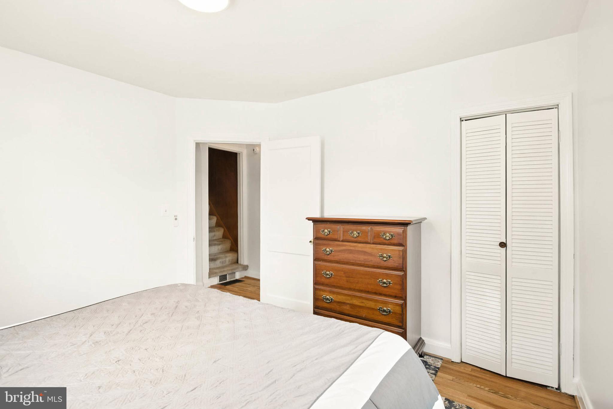 56 Ridgemoor Road Essex, MD 21221 - Photo 14 of 27 a bedroom with a bed and a dresser