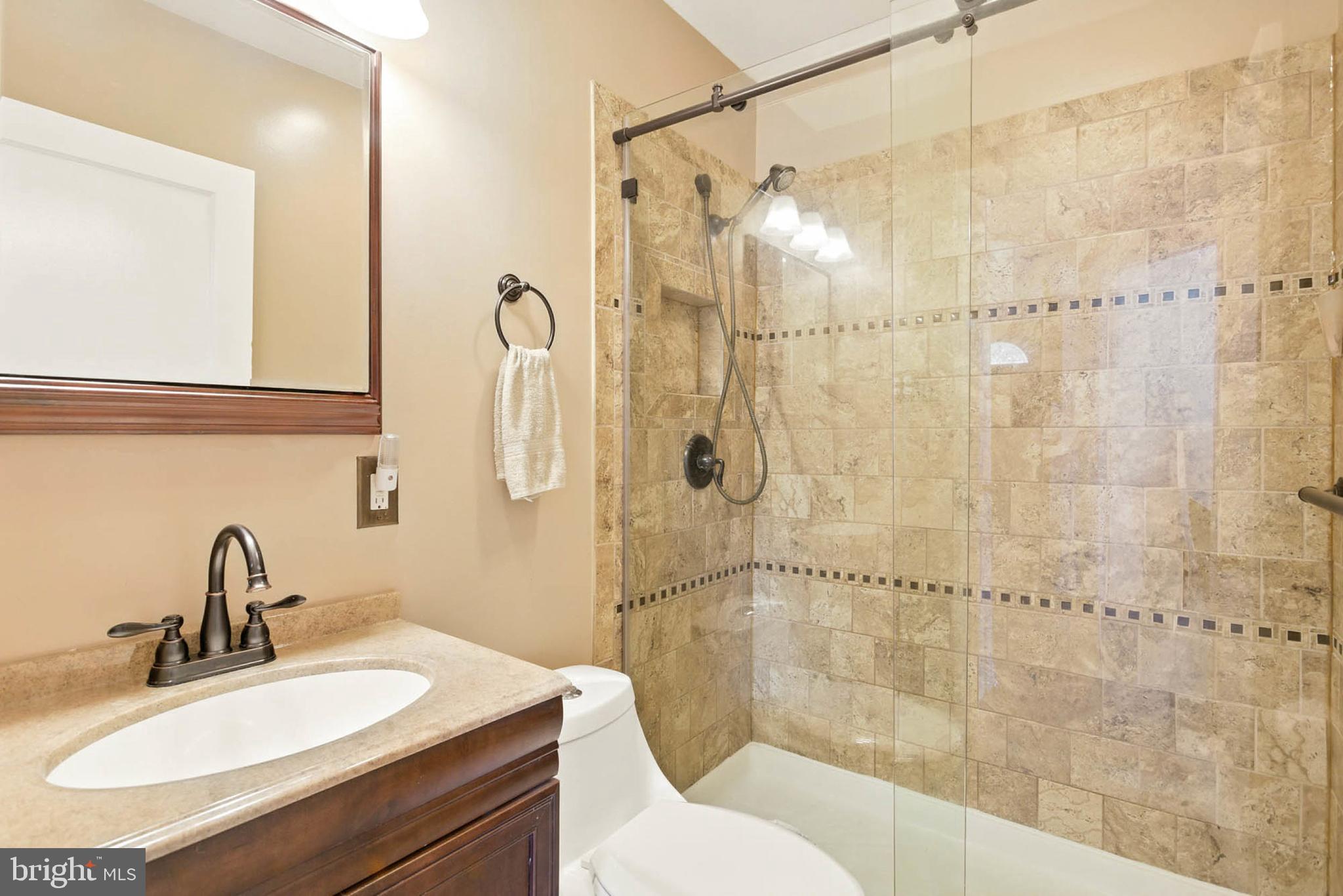 56 Ridgemoor Road Essex, MD 21221 - Photo 17 of 27 a bathroom with a sink and a mirror