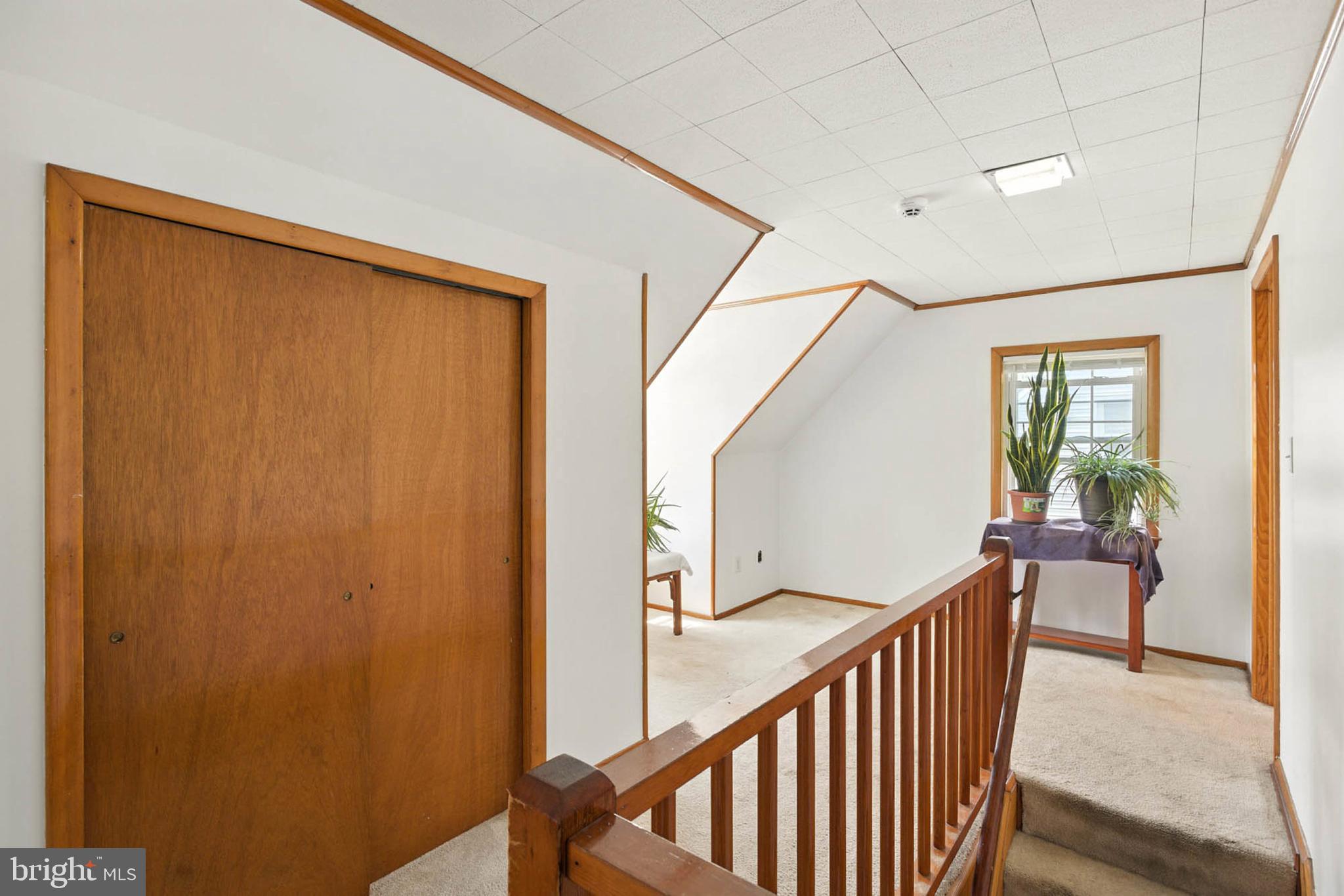 56 Ridgemoor Road Essex, MD 21221 - Photo 18 of 27 a view of a hallway with wooden floor and staircase
