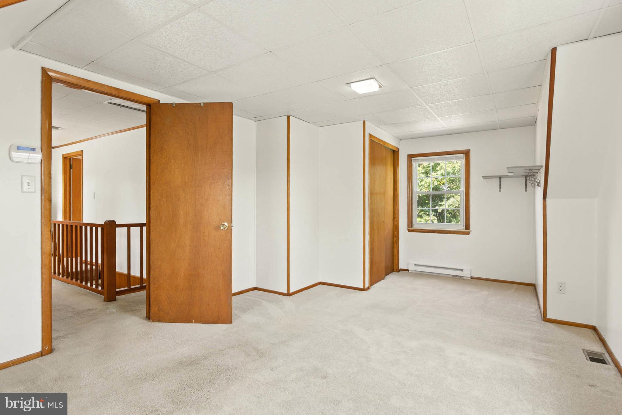 56 Ridgemoor Road Essex, MD 21221 - Photo 22 of 27 an empty room with windows and closet