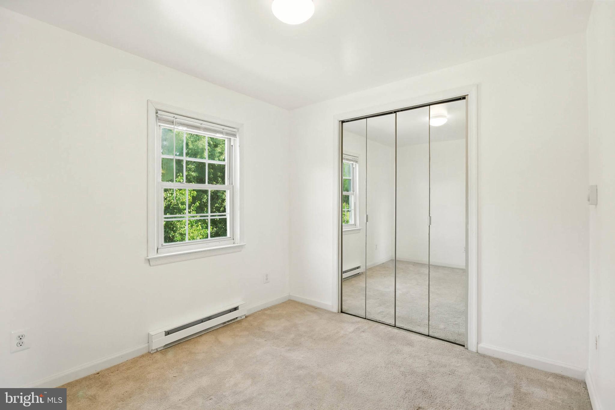 56 Ridgemoor Road Essex, MD 21221 - Photo 23 of 27 an empty room with windows and closet