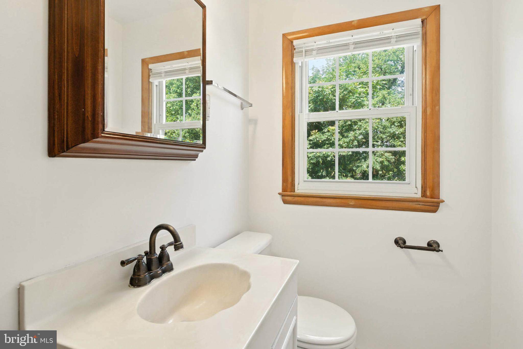 56 Ridgemoor Road Essex, MD 21221 - Photo 25 of 27 a bathroom with a sink and a toilet