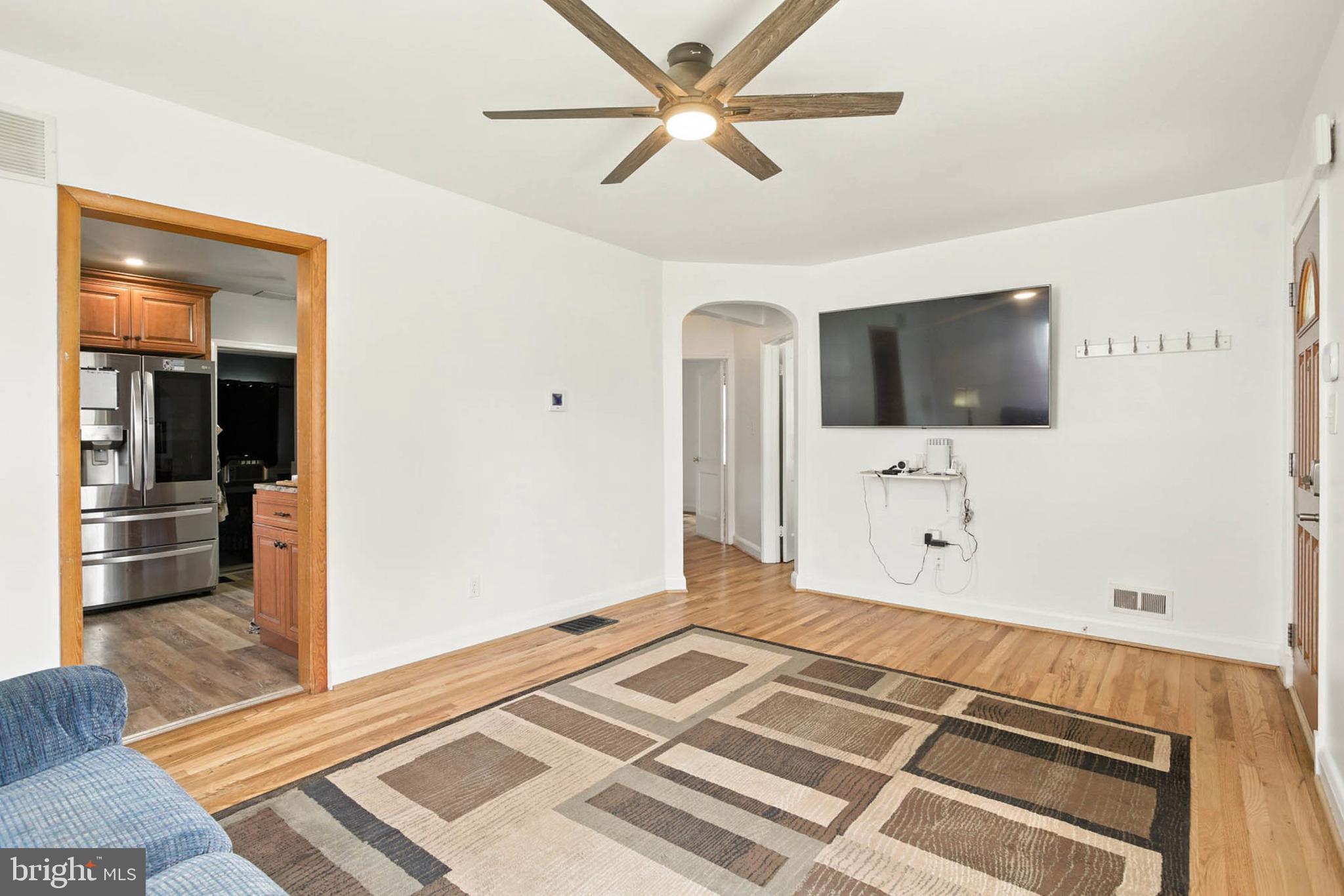 56 Ridgemoor Road Essex, MD 21221 - Photo 4 of 27 a bedroom with a bed and a flat screen tv