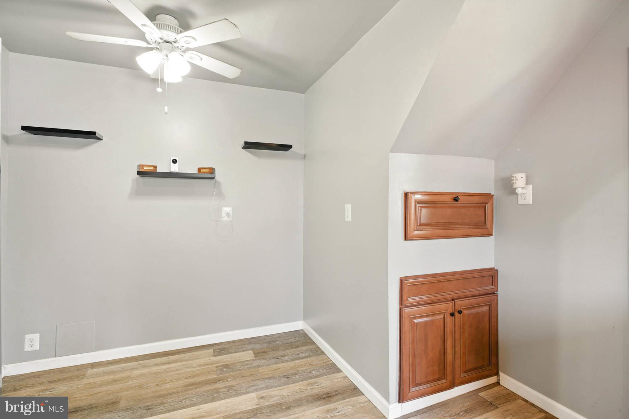 56 Ridgemoor Road Essex, MD 21221 - Photo 10 of 27 an empty room with closet and a ceiling fan