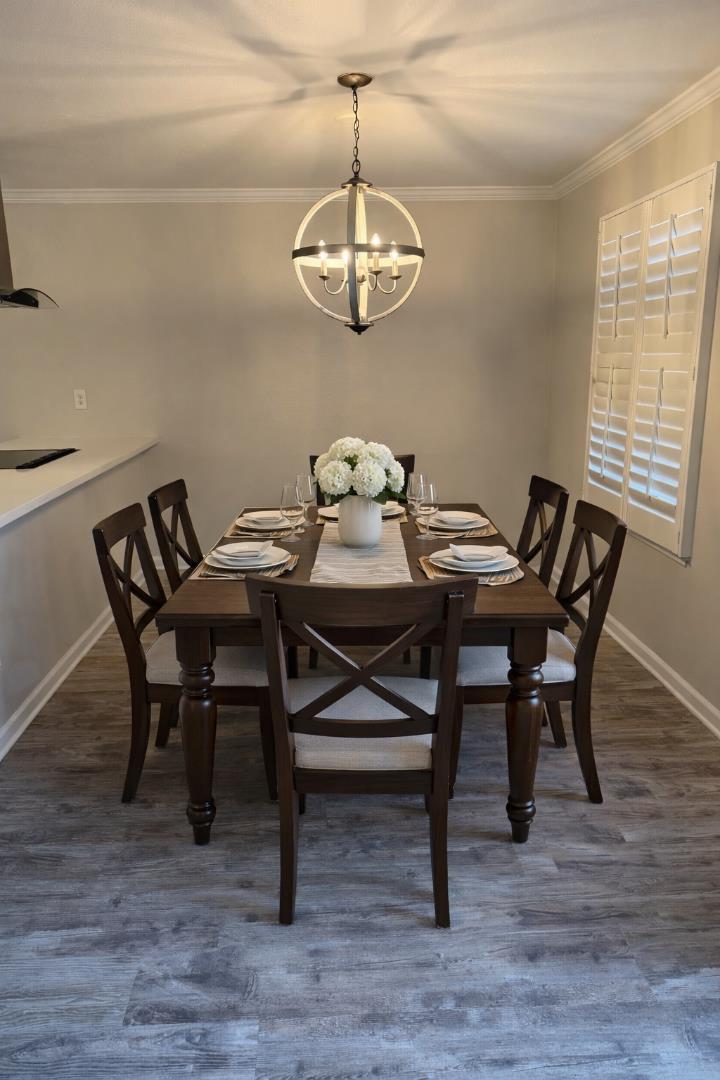 311 Bean Creek Road, Unit 305 Scotts Valley, CA 95066 - Photo 3 of 11 a view of a dining room with furniture wooden floor and chandelier