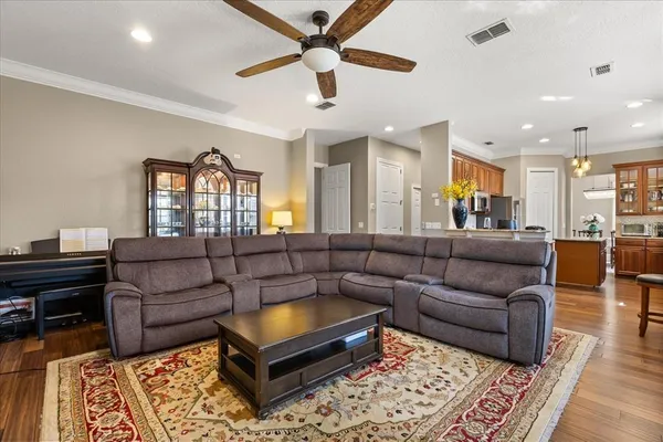 a kitchen with granite countertop a sink appliances cabinets and dining table