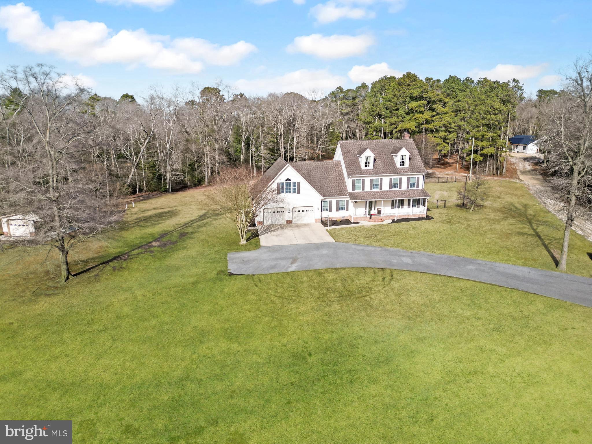 18981 Kenney Road Delmar, DE 19940 - Photo 1 of 31 a view of a lake with a mountain in the background