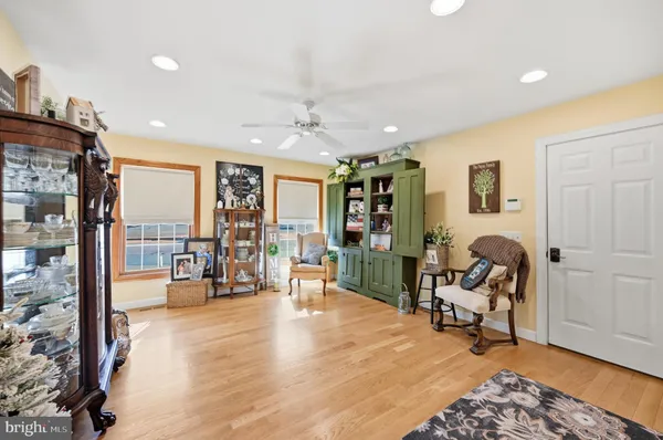 a view of a livingroom with workspace and a window