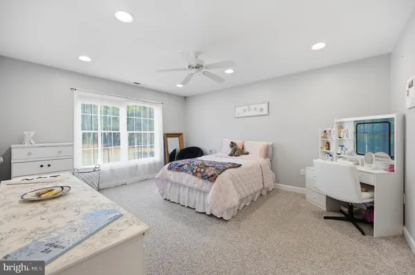 a bedroom with a bed and a table