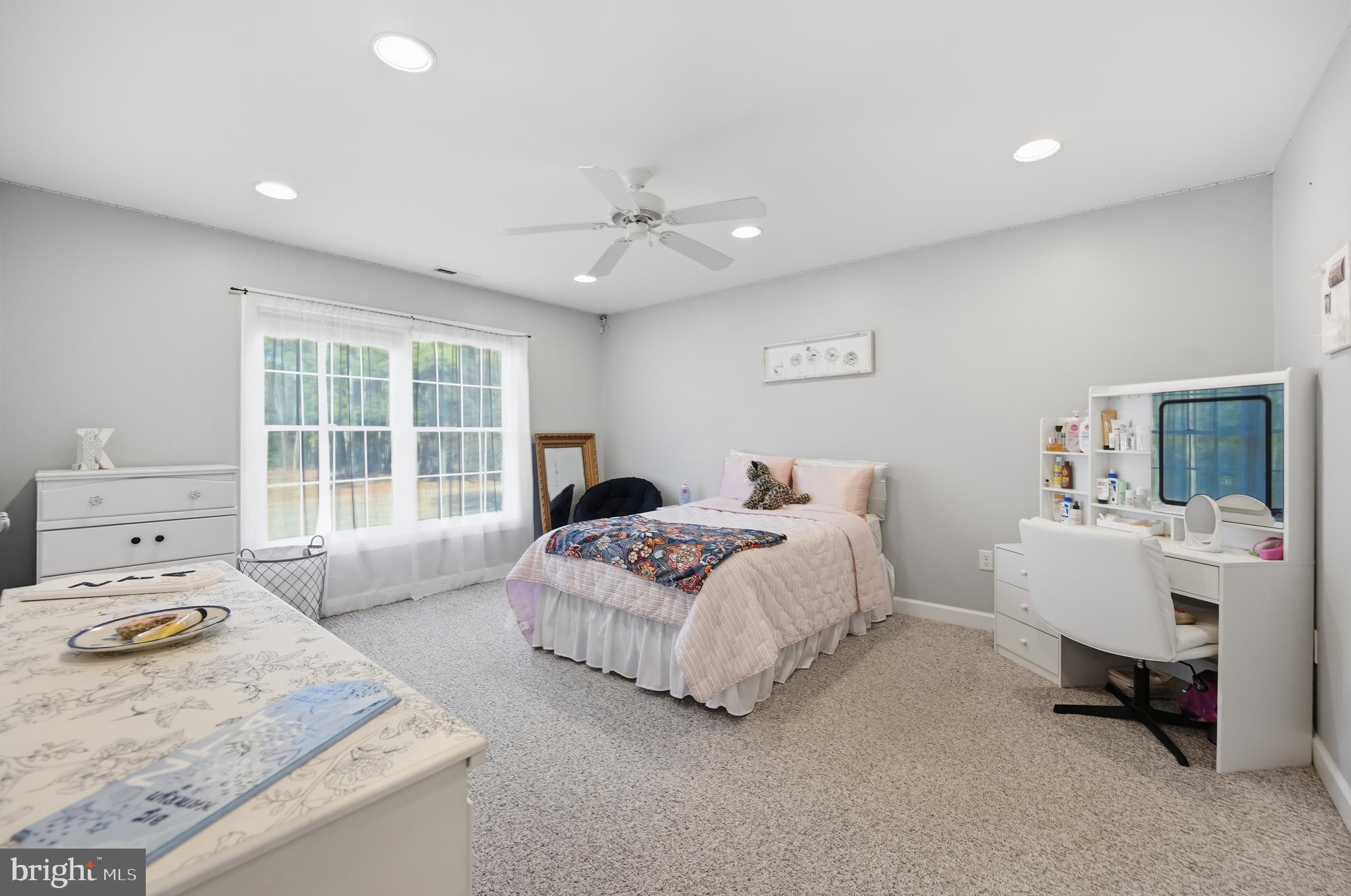 18981 Kenney Road Delmar, DE 19940 - Photo 21 of 31 a bedroom with a bed and a table
