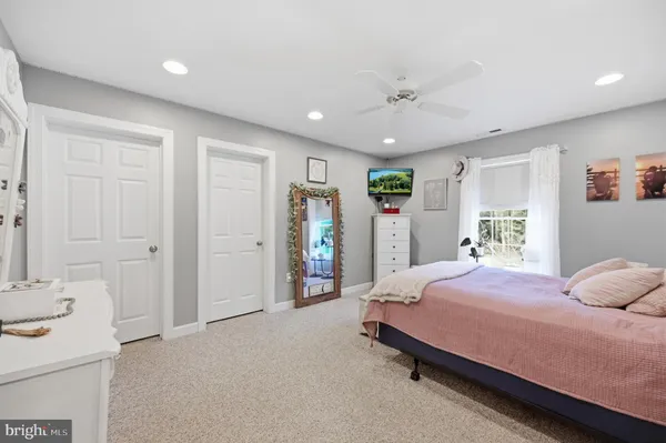 a bedroom with a bed and a walk in closet