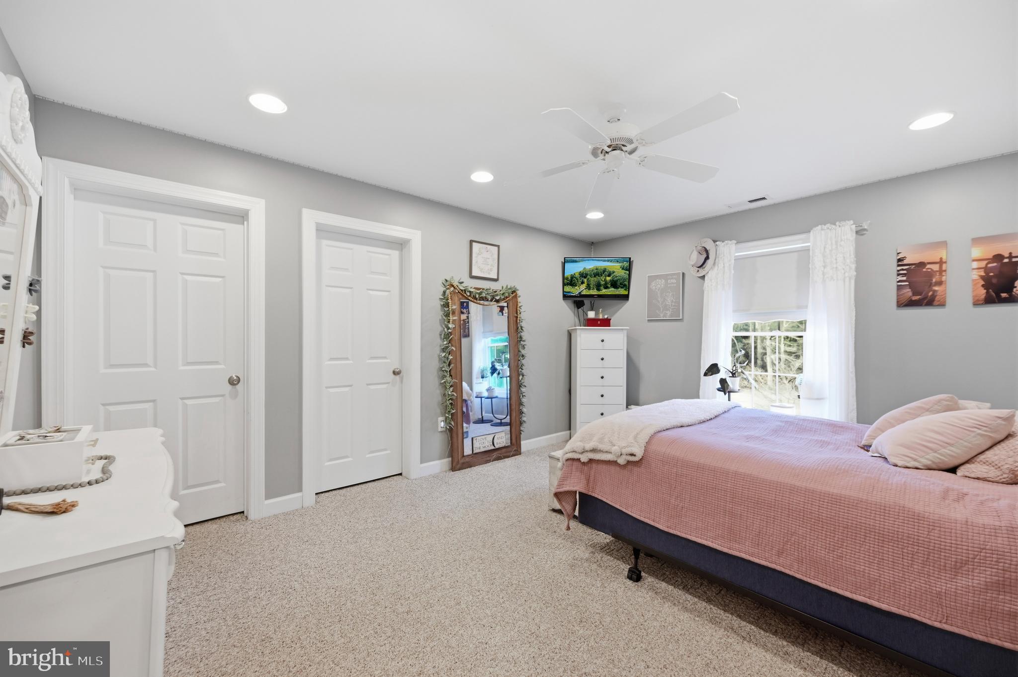 18981 Kenney Road Delmar, DE 19940 - Photo 22 of 31 a bedroom with a bed and a walk in closet
