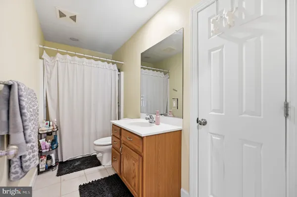 a bathroom with a sink a mirror and a shower